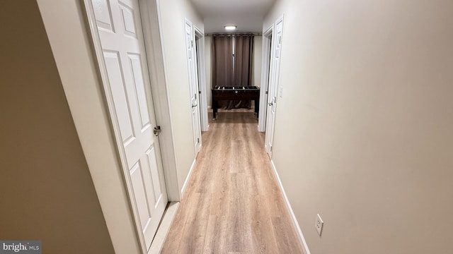 hall with light hardwood / wood-style flooring