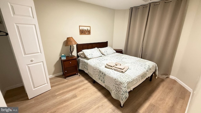 bedroom with light wood-type flooring