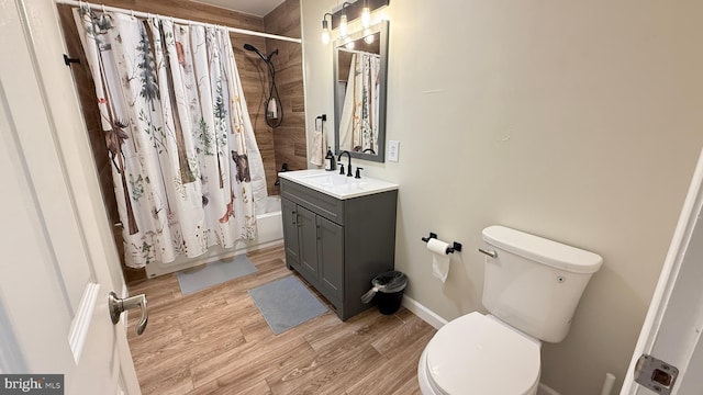 full bathroom with wood-type flooring, vanity, toilet, and shower / bathtub combination with curtain