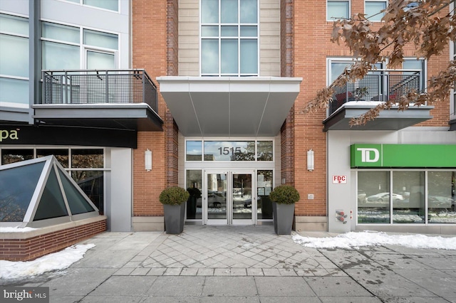 property entrance with brick siding