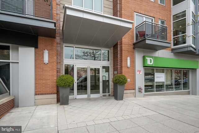 property entrance with brick siding