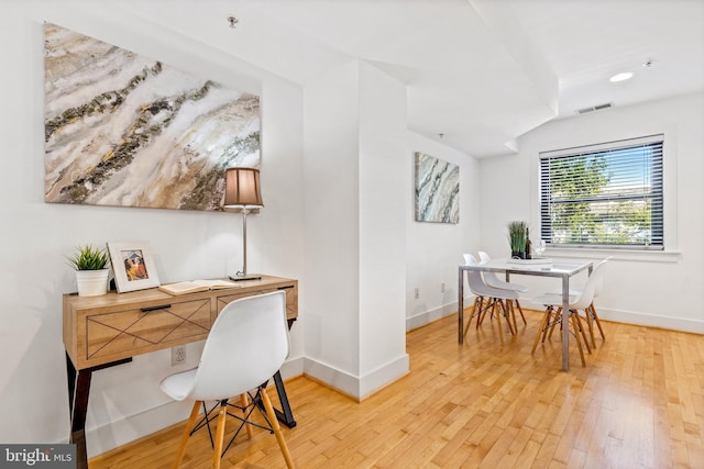 office space with wood-type flooring