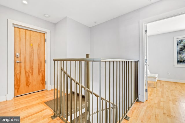 corridor featuring hardwood / wood-style flooring