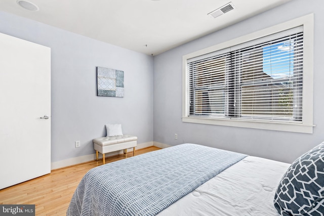 bedroom featuring wood-type flooring