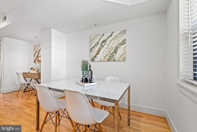 dining room featuring hardwood / wood-style flooring