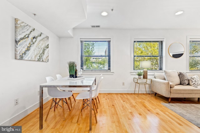 dining area with hardwood / wood-style floors