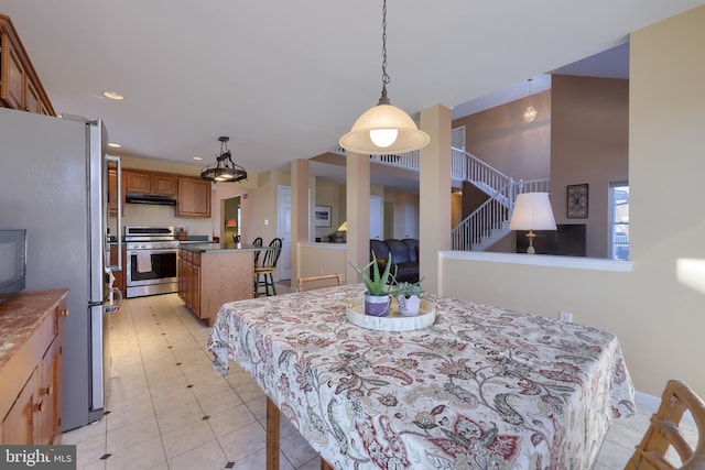 dining space featuring light tile patterned flooring