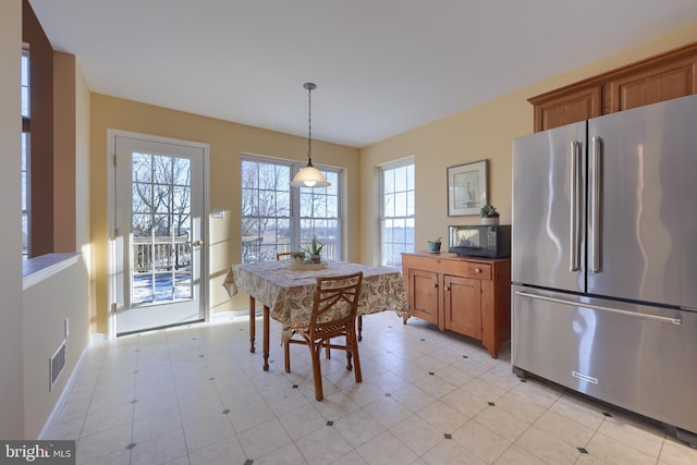 dining space featuring light tile patterned floors