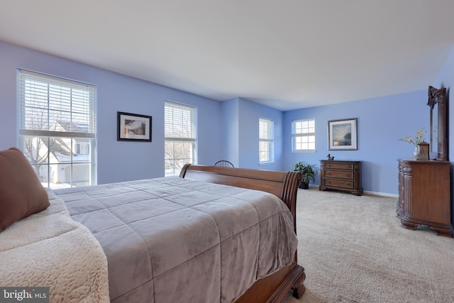 bedroom featuring light colored carpet