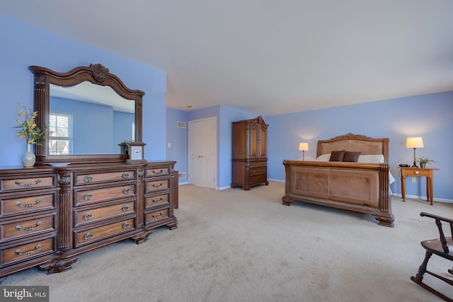 bedroom featuring light carpet