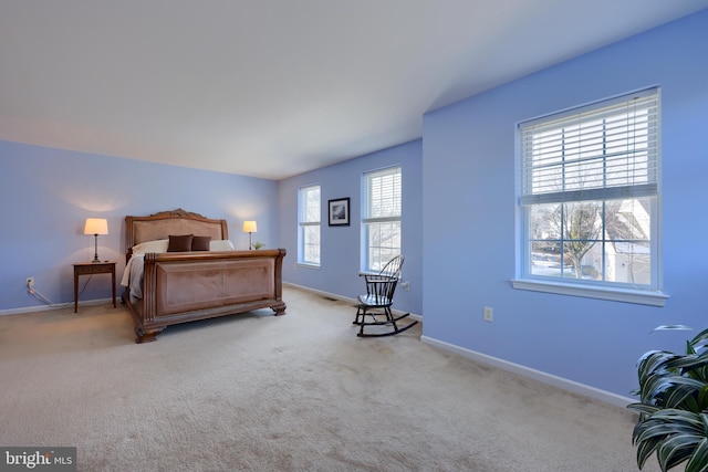 bedroom with light colored carpet