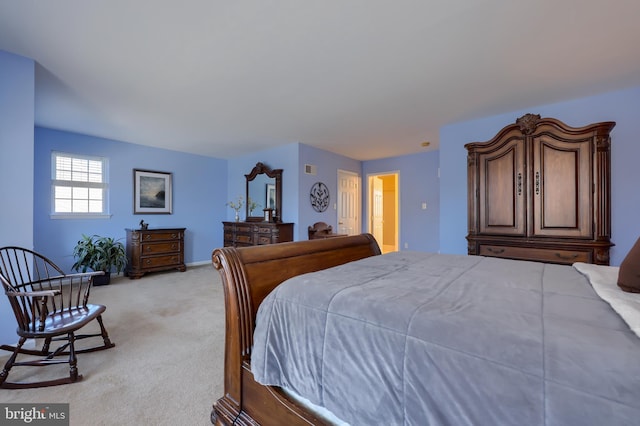 bedroom featuring light colored carpet