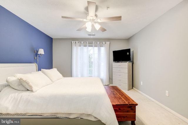 bedroom with ceiling fan and light colored carpet