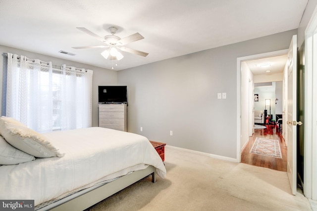 carpeted bedroom featuring ceiling fan