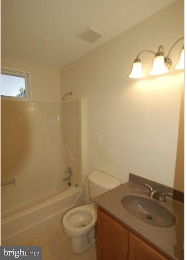 full bathroom featuring bathtub / shower combination, tile patterned floors, vanity, and toilet