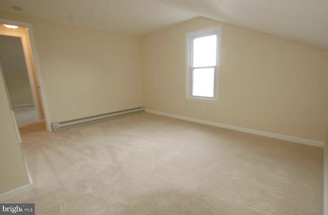 bonus room featuring baseboard heating, light colored carpet, and lofted ceiling