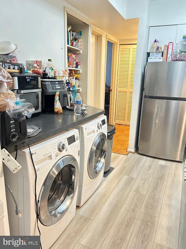 laundry room with light hardwood / wood-style floors