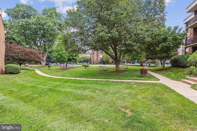 view of home's community with a lawn