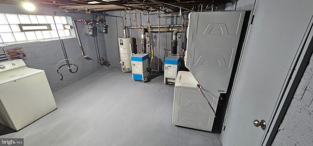 basement featuring water heater and washer / clothes dryer