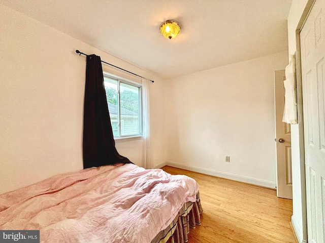 bedroom with light hardwood / wood-style flooring