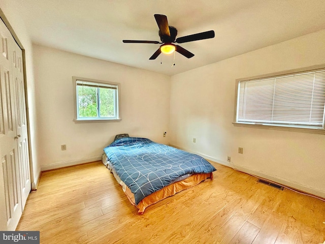 bedroom featuring hardwood / wood-style flooring and ceiling fan