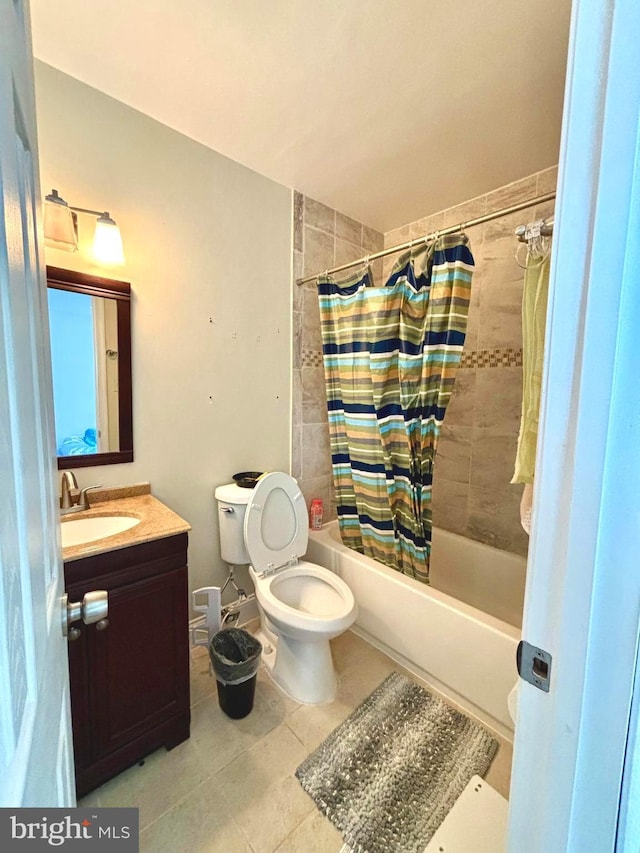 full bathroom with shower / bath combo, vanity, and toilet