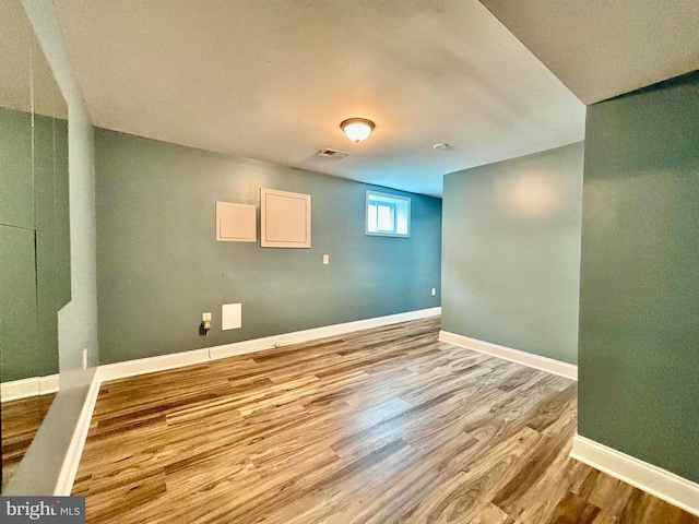 basement featuring light wood-type flooring