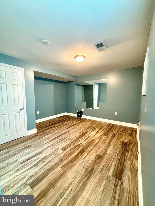 basement with wood-type flooring