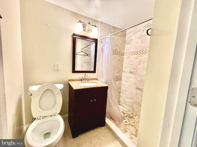 bathroom featuring tile patterned floors, vanity, curtained shower, and toilet