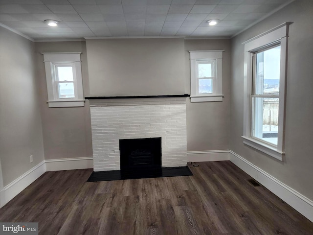 details with hardwood / wood-style flooring, crown molding, and a fireplace