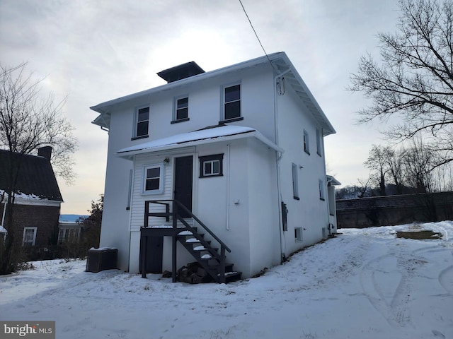 view of front of house featuring cooling unit