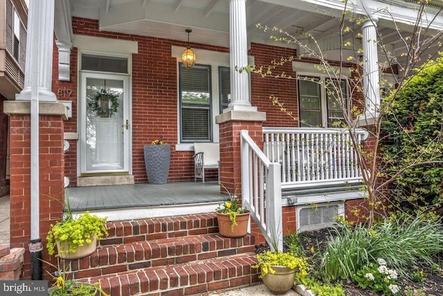 doorway to property featuring covered porch