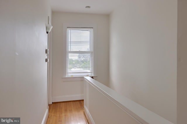 corridor with light hardwood / wood-style flooring