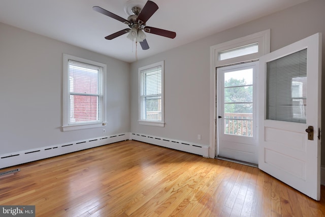 interior space with ceiling fan, a baseboard radiator, and light wood-type flooring