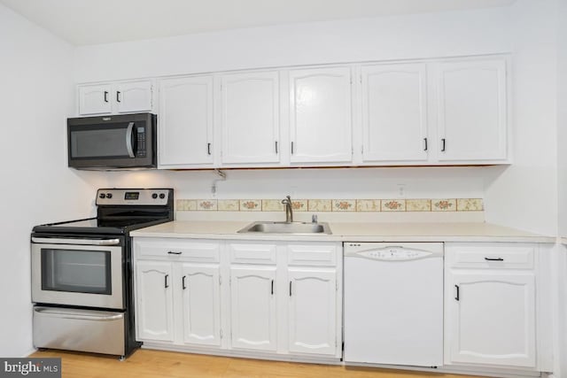 kitchen featuring sink, white cabinetry, dishwasher, and stainless steel electric range