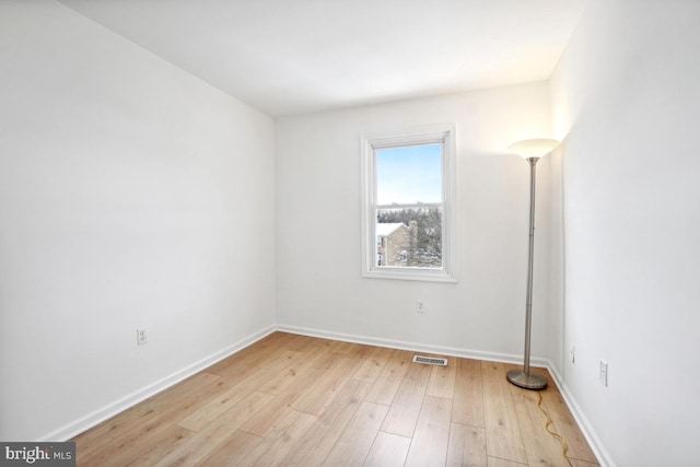 spare room with light wood-type flooring