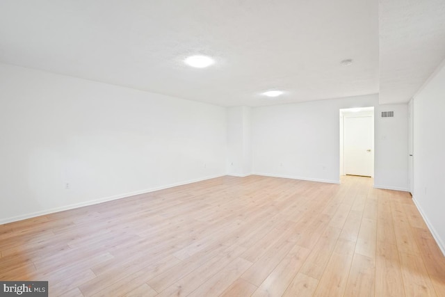 spare room featuring light hardwood / wood-style floors