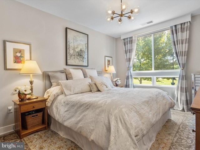 bedroom with an inviting chandelier