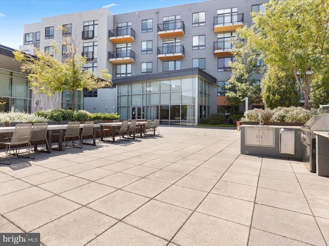 view of property's community featuring a patio area