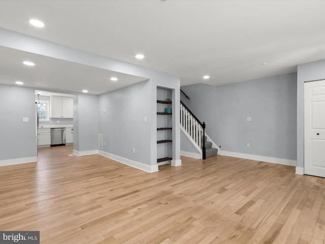 unfurnished living room with light hardwood / wood-style flooring