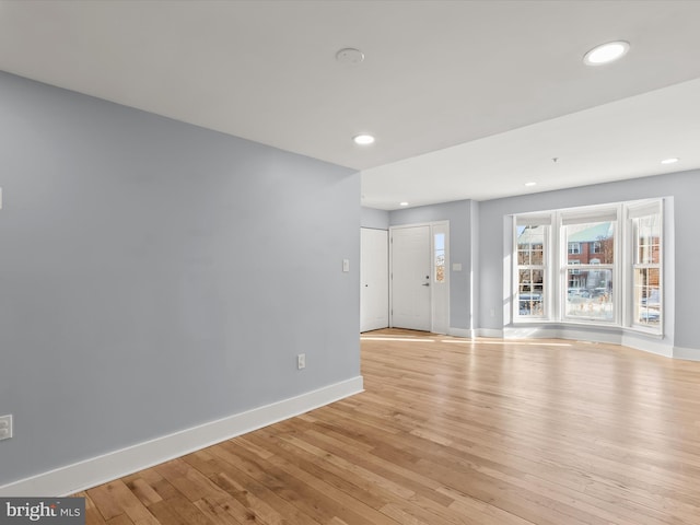 unfurnished living room with light hardwood / wood-style floors