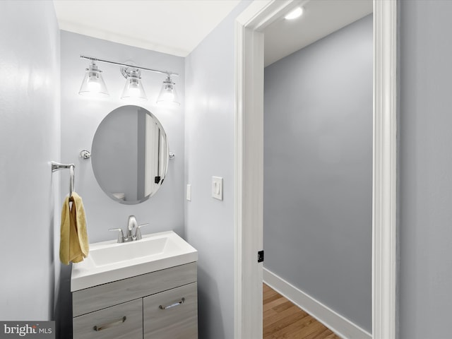 bathroom with wood-type flooring and vanity