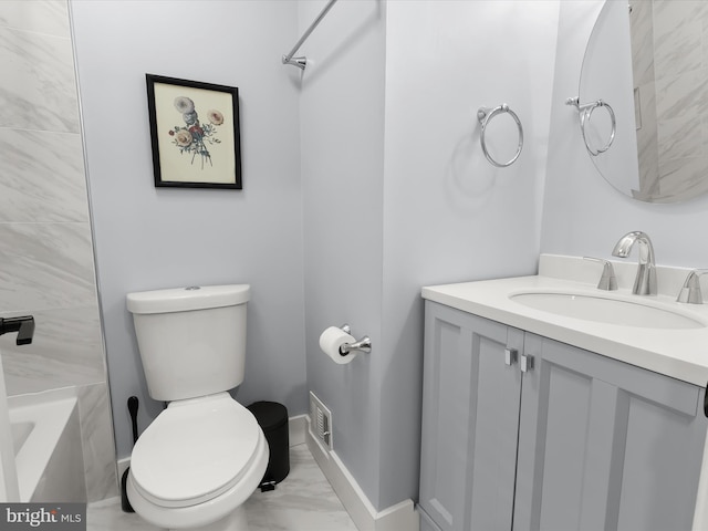 bathroom featuring vanity and toilet