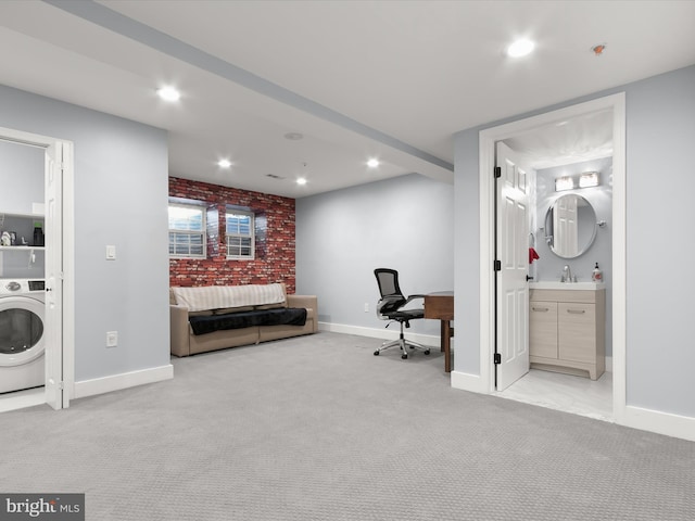 interior space with washer / dryer and brick wall