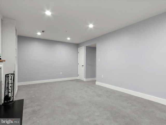 unfurnished living room with light carpet