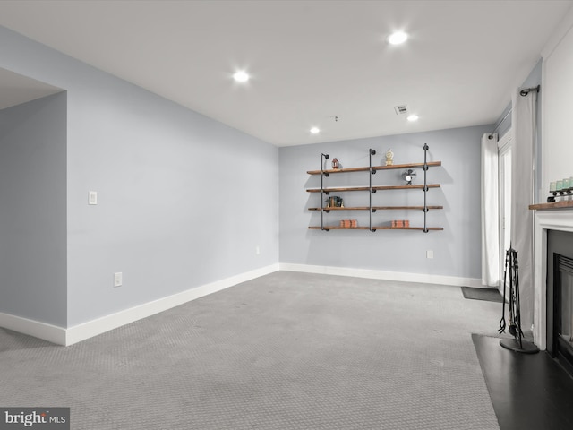 unfurnished living room featuring carpet