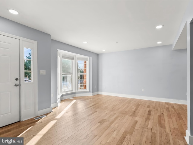 foyer with light hardwood / wood-style floors