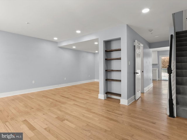 interior space with light hardwood / wood-style floors and built in features