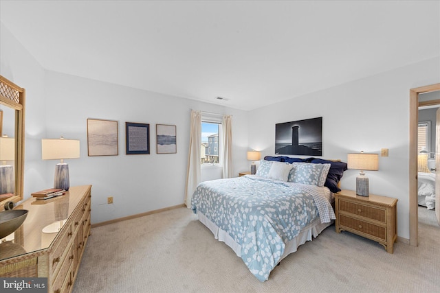 bedroom with light colored carpet