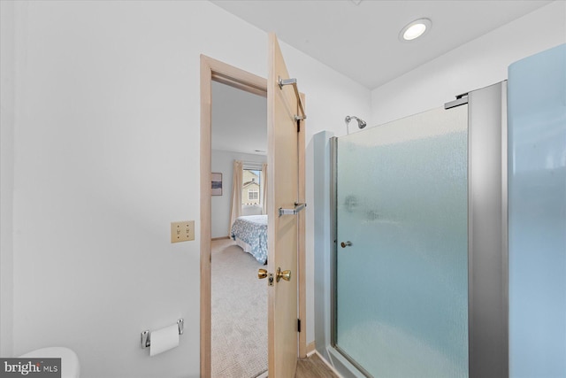 bathroom featuring an enclosed shower